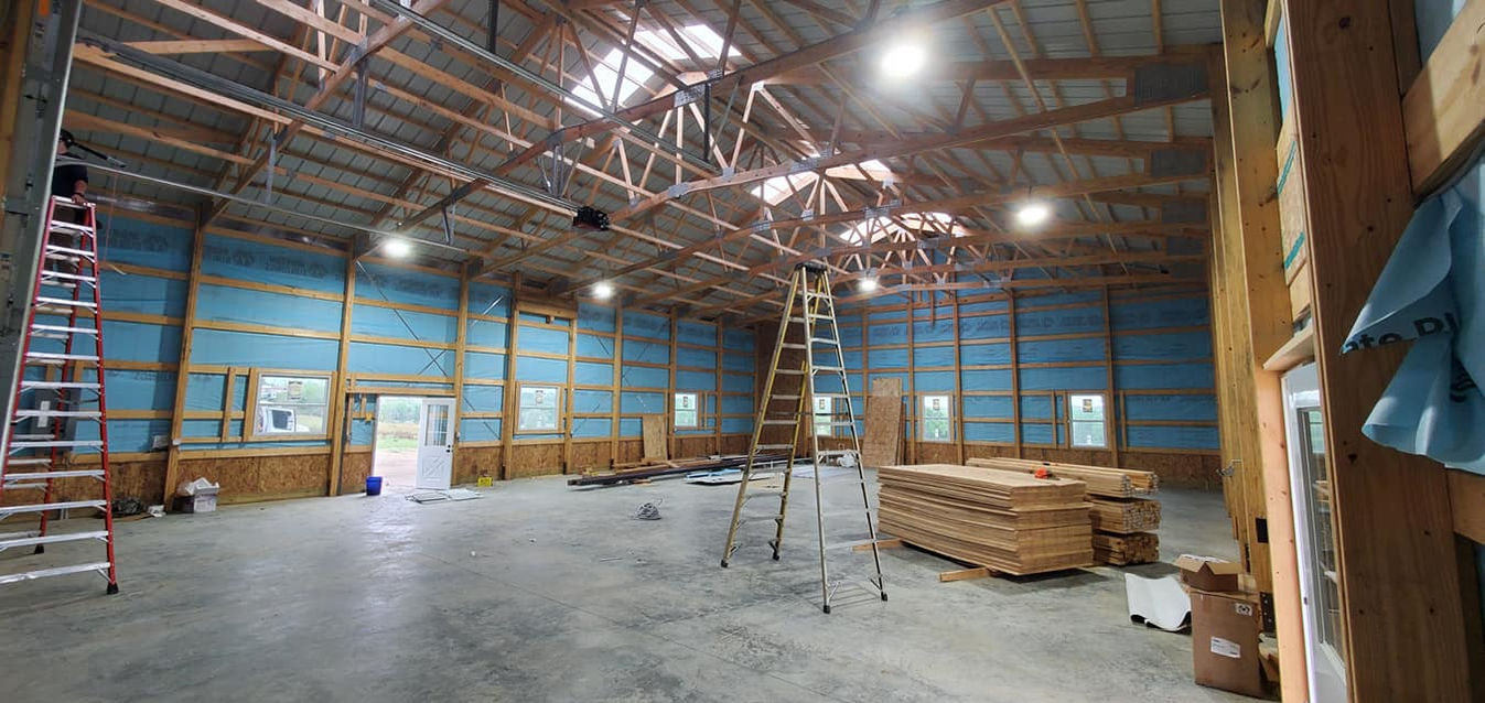 Electrical work inside a large barn structure